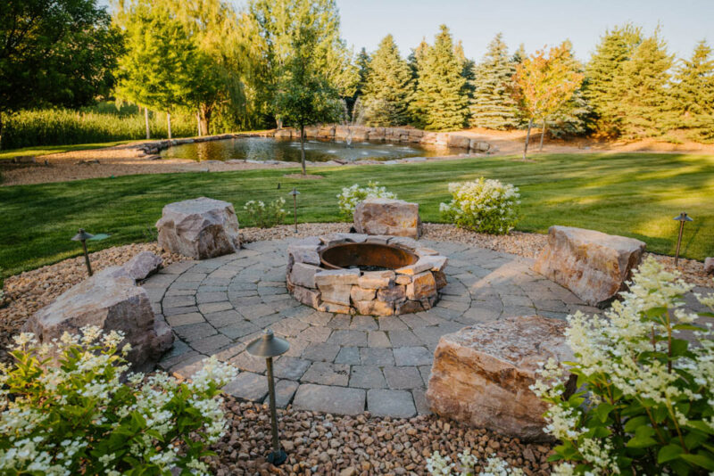 rustic backyard patio with firepit