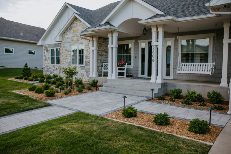 front yard paver walkway with general landscaping