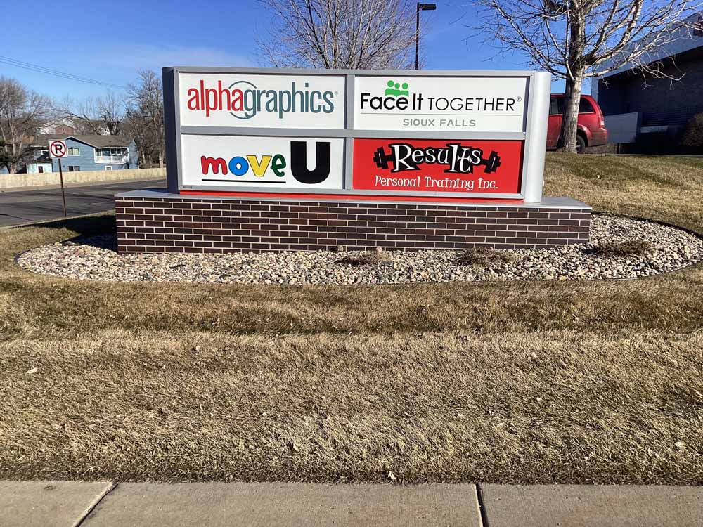 AlphaGraphics in Sioux Falls before updating their landscaping with Weller Brothers Landscape Professionals