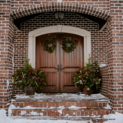 Front porch with festive Christmas greenery