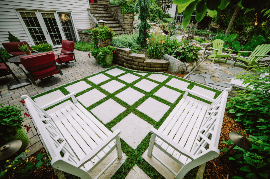 tile patio with green turf and patio furniture