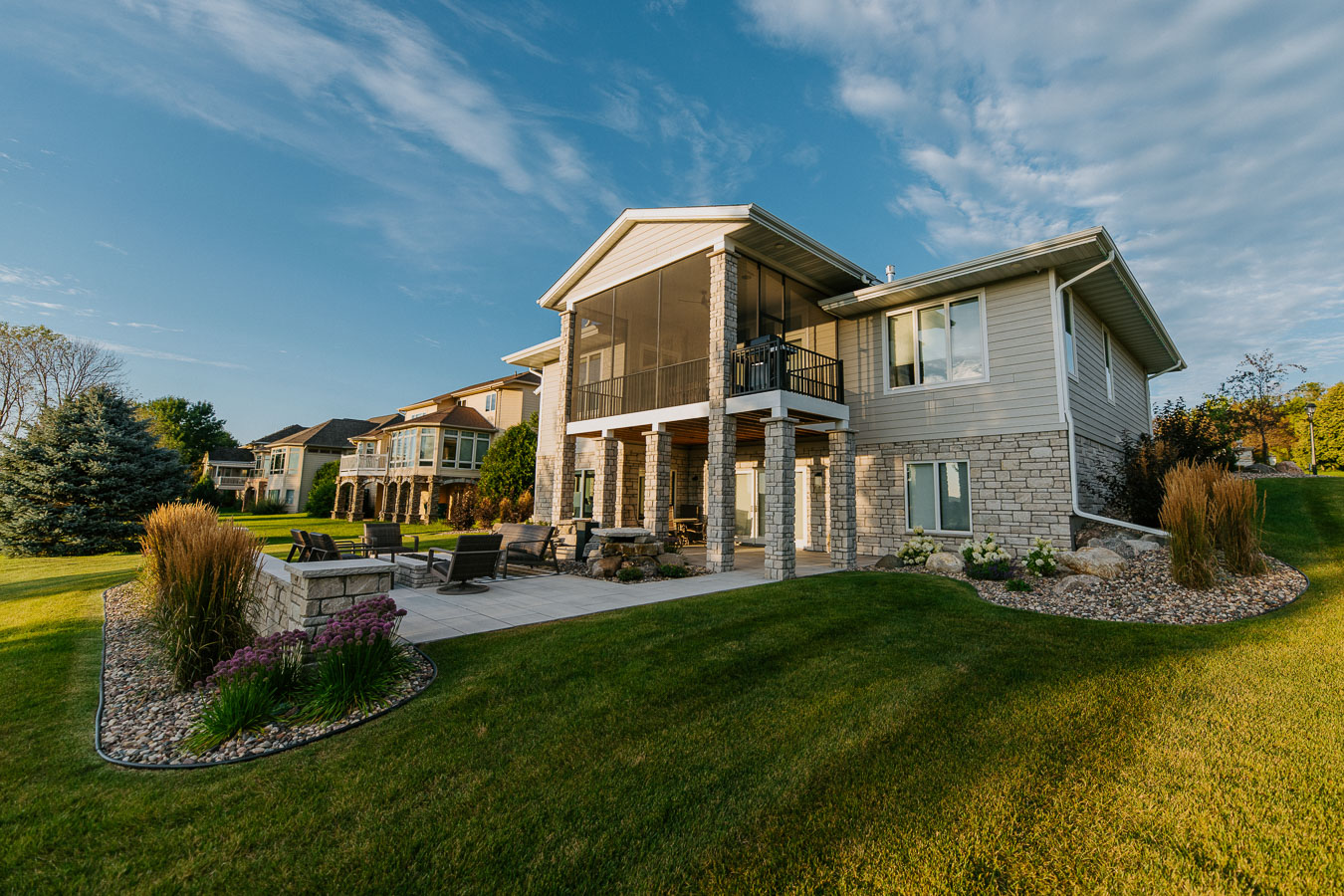 Landscape design in Rochester, MN featuring a screened porch