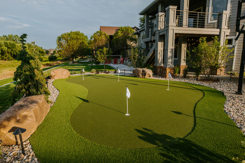 artificial turf putting green in a backyard