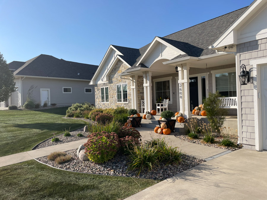 a front home and walkway before updated landscaping