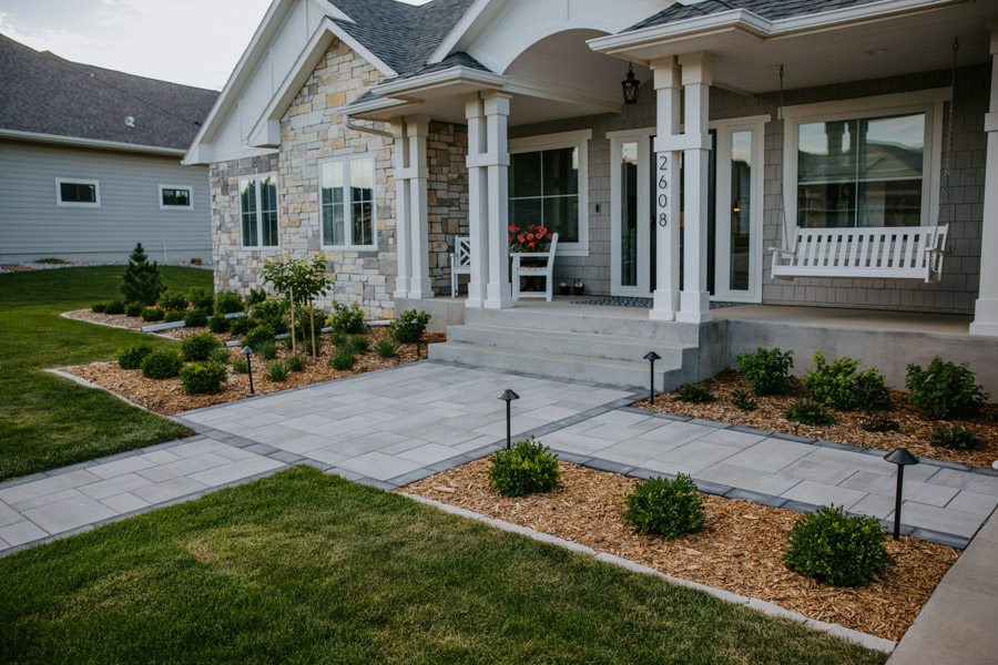 front residential walkway with updated pavers and plants